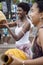 Women playing Abe or Xequere, percussion musical instrument created in Africa