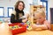 Women playing with kids in day care center