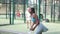 Women playing padel tennis match during training on court