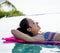 Women on a pool inflatable