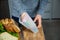 A women prepares lunch and puts a sandwich into a food-grade silicone bag as part of a zero-waste lifestyle