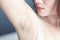 Women problem black armpit with grey background for skin care and beauty concept, selective focus