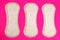 Women protection hygiene daily pads on pink background