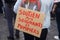 women protesting in the street with text on cardboard in french : soutien aux signets et pompiers, in English : support