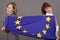 Women pulling on european flag