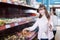 Women purchasing confectionery in shop together