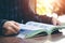 Women read holiday book in room quiet environment