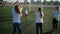 Women are rejoicing by save of goalkeeper on training of children football team