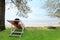 A Women relax on cradle Sea beach nature scene. Tropical beach h