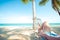 Women relax and sunbathe on hammock at sandy tropical beach