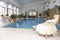 Women Relaxing Around Pool At Spa