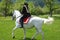 Women riding Andalusian horse