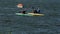 Women row sports canoes with paddles along tranquil river