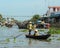Women rowing boat at floating market in Mekong Delta, Vietnam