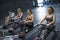 Women rowing in gym and training in fitness crossfit room