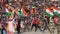 Women run with Indian flags at the military ceremony at India-Pakistan border