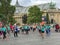 Women runners in La Parisienne round corner in front of Grand Pa