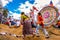 Women running in front of kite, All Saints\' Day, Guatemala