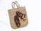 Women`s accessories - eco straw shopper bag and roman leather sandals on a light background, top view