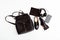 Women`s backpack, shoes, phone and headphones in black. Women`s leather fashion accessories. Flat lay, top view.