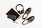 Women`s backpack, shoes, phone and headphones in black. Women`s leather fashion accessories. Flat lay, top view. Spring fashion co