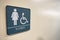 Women's bathroom sign on wall with space for text and handicapped symbol