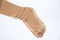 Women`s beige nylon stockings on a white background close up