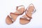 Women\'s brown sandals on white background. top view