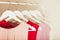 Women`s clothing in pink tones on a white hanger.