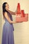 Women`s Day. christmas, boxing day, woman with red present box, birthday