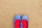 Women`s flat summer shoes, against a sand background