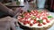 Women\'s hand is cutting freshly cooked homemade strawberry cheesecake New York, close-up, 4k