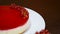 Women`s hand decorated cheesecake red currant. Summer dessert.