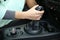 Women`s hand is on the gear lever of the automatic transmission