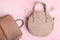 Women`s handbag, beige backpack and cosmetics