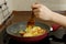 Women`s hands cook in the kitchen