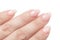 Women`s hands with perfect Nude manicure. Nail Polish is a natural pale pink shade. Isolated on white