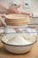 Women\'s hands prepairing flour before baking pie