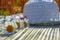 Women`s hat and daisies lying on the table. Background blur