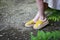 Women`s legs in stylish summer sandals with straw soles, concept of comfortable shoes, side view