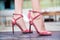 Women`s legs in summer high-heeled shoes