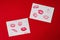 Women`s lips lipstick kiss print set for Valentine`s Day and love collection on white paper on red . The shape of the lip makeup