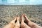 Women`s and men`s feet on beach