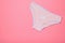 Women`s pink cotton panties with polka dots on pink background. Beautiful lingerie