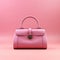 Women's pink handbag on pink background