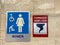The women`s restroom and tornado shelter signs directing people to the shelter