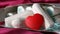 Women`s sanitary tampons with red heart in the box, hygiene products