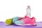 Women`s Sports Shoes, Water Bottles, Towels on a fitness pad ,isoalted on white background