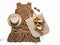 Women`s summer clothing - brown polka dot dress, straw tote bag, suede wedge sandals, sunglasses on a light background, top view.