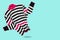 Women\\\'s sweater with a collar, in black and crimson stripes, as if dancing, concept, on a turquoise background